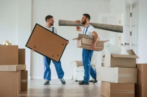 painting-mat-hands-two-moving-service-employees-room_146671-106546